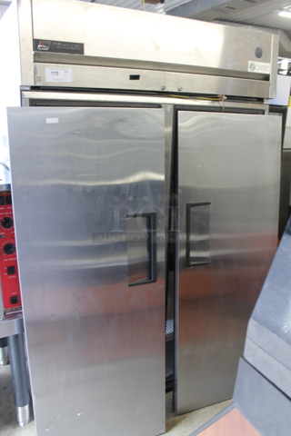 2015 True TG2R-2S Commercial Stainless Steel 2 Door Reach-In Cooler With Polycoated Shelves With Commercial Casters. 115V, 1 Phase. Doors Need To Be Re-Attached. Tested and Powers On But Does Not Get Cold