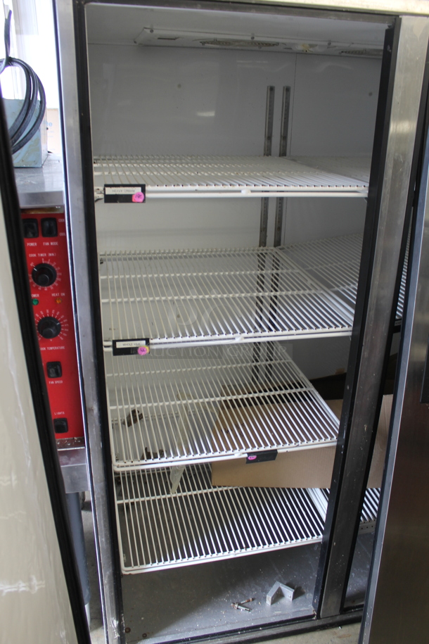 2015 True TG2R-2S Commercial Stainless Steel 2 Door Reach-In Cooler With Polycoated Shelves With Commercial Casters. 115V, 1 Phase. Doors Need To Be Re-Attached. Tested and Powers On But Does Not Get Cold - Image 4 of 8
