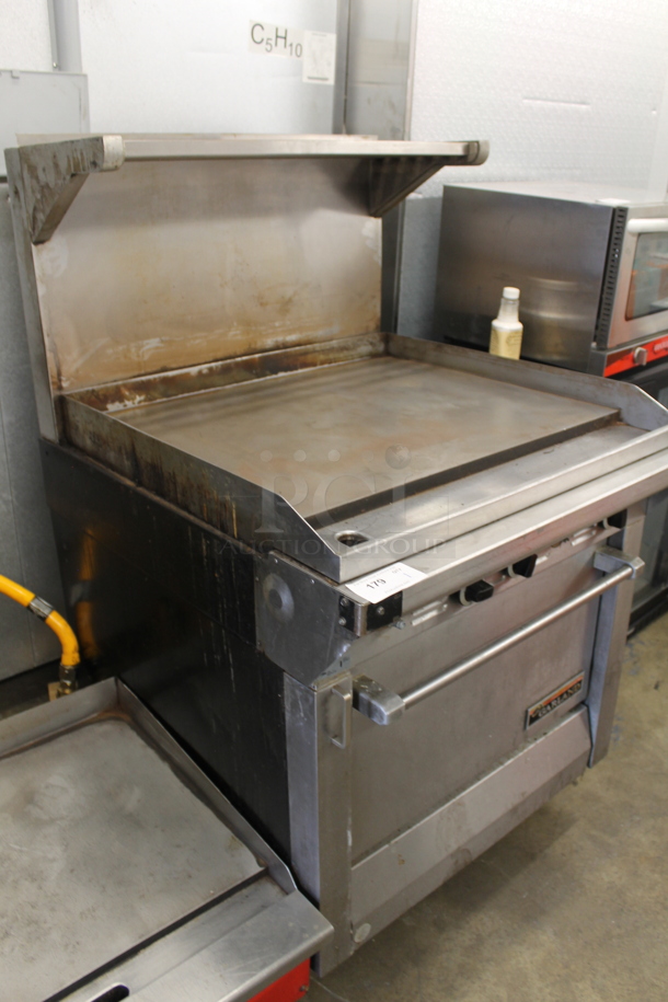 Garland M47R Commercial Stainless Steel Natural Gas Powered Griddle With Oven And Backsplash With Overshelf.  - Image 2 of 9