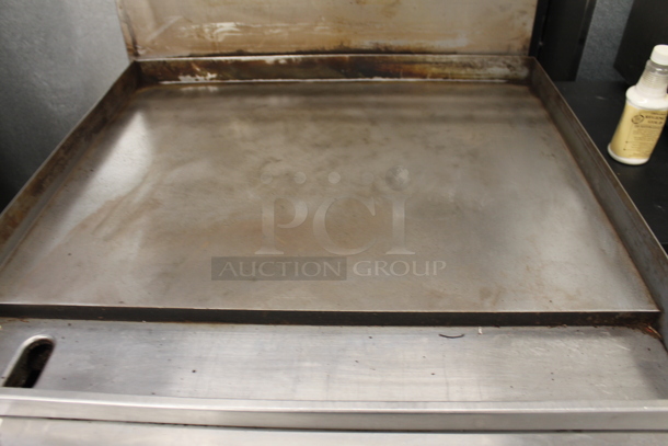 Garland M47R Commercial Stainless Steel Natural Gas Powered Griddle With Oven And Backsplash With Overshelf.  - Image 4 of 9