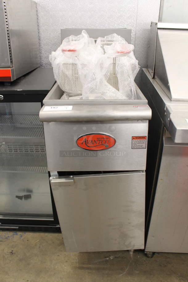 BRAND NEW SCRATCH AND DENT! 2021 Avantco FF300-P Commercial Stainless Steel Propane Gas Floor Fryer With 2 Fryer Baskets On Galvanized Legs. 90,000 BTU.  - Image 1 of 6