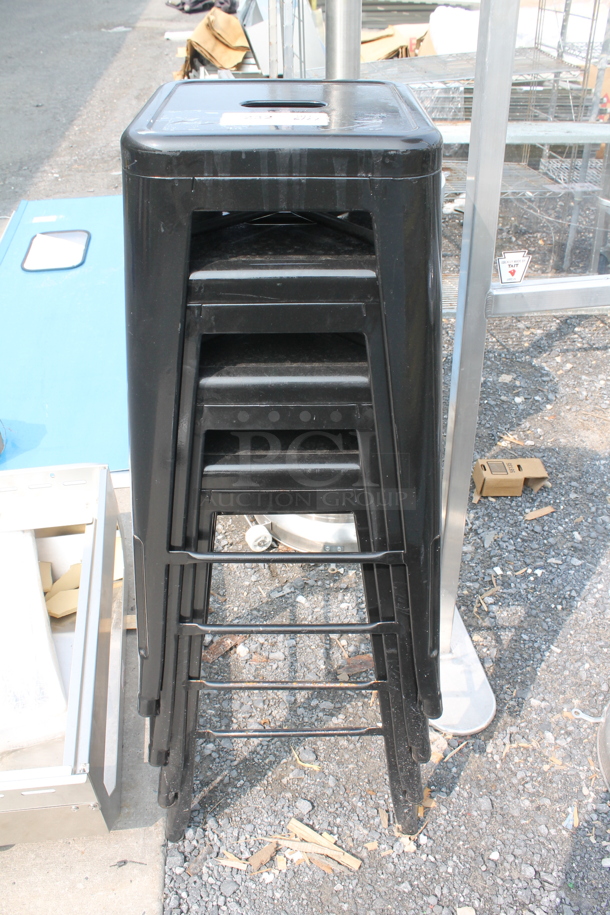 6 Stackable Black Indoor/Outdoor Stools. 6 Times Your Bid! Cosmetic Condition May Vary. - Image 1 of 6