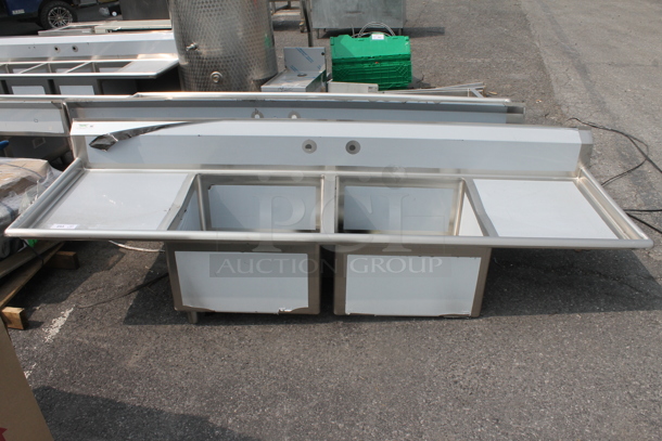 BRAND NEW SCRATCH AND DENT! Regency 600S22424224 Commercial Stainless Steel 2 Bay Sink With Left And Right Side Drainboards On Galvanized Legs. Sink 24x24x14 And Drainboard 22x26 - Image 1 of 6