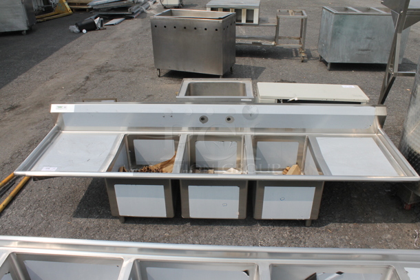 BRAND NEW SCRATCH AND DENT! Regency 600S31824224 Commercial Stainless Steel 3 Bay Sink With Left And Right Side Drainboards On Galvanized Legs. Sink 18x24x14 And Drainboard 22x26 - Image 1 of 8