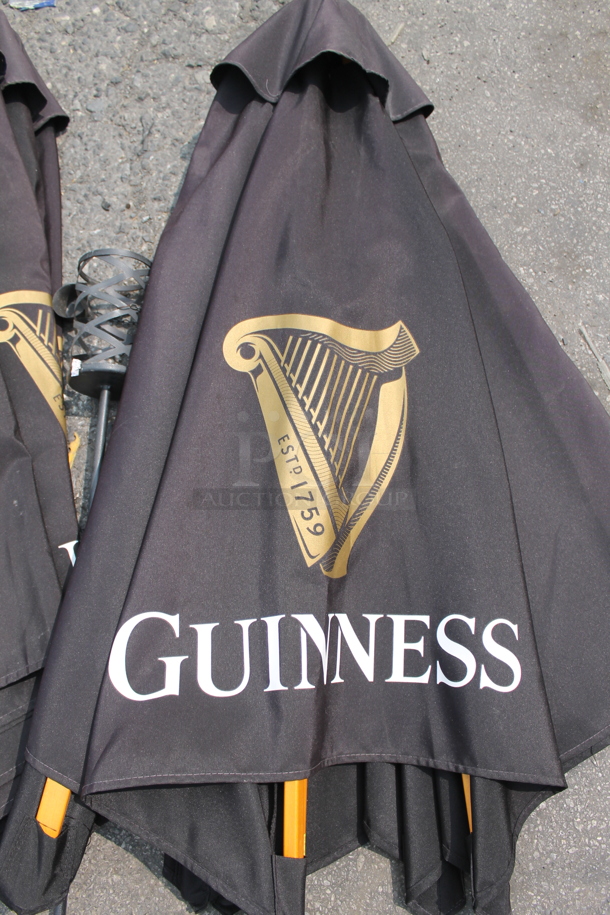 ALL ONE MONEY! Lot of 2 Black Outdoor Table Umbrellas And Outdoor Torch - Image 2 of 3