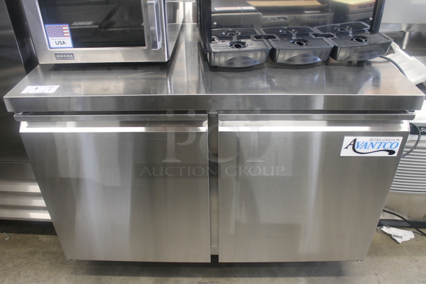 BRAND NEW SCRATCH AND DENT! Avantco 178SSWT48RHC Commercial Stainless Steel 2-Door Worktop Cooler With Backsplash And Polycoated Shelves On Commercial Casters. 115V. Tested and Powers On But Does Not Get Cold
 - Image 1 of 9