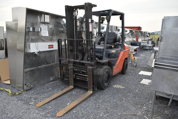 Toyota 8FGU30 Metal Commercial Propane Gas Powered Fork Lift w/ Fork Positioner and Key. 8,771.7 Hours. 5,500 Pound Weight Capacity. Weight 9,915 Pounds. Tires FR: 28x9-15 Solid. Tires RR 6.50x10 Solid. Tilt Hydraulic No Longer Attached. All Other Hydraulics are Functioning. Mast Tilt Requires Repairs. Propane Tank Is Not Included But You Can Use It To Drive The Forklift Onto Your Flatbed For Pick Up. Runs and Drives! - Image 4 of 12