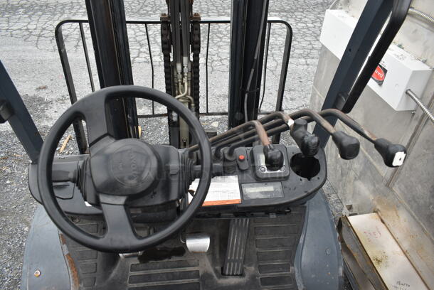 Toyota 8FGU30 Metal Commercial Propane Gas Powered Fork Lift w/ Fork Positioner and Key. 8,771.7 Hours. 5,500 Pound Weight Capacity. Weight 9,915 Pounds. Tires FR: 28x9-15 Solid. Tires RR 6.50x10 Solid. Tilt Hydraulic No Longer Attached. All Other Hydraulics are Functioning. Mast Tilt Requires Repairs. Propane Tank Is Not Included But You Can Use It To Drive The Forklift Onto Your Flatbed For Pick Up. Runs and Drives! - Image 6 of 12