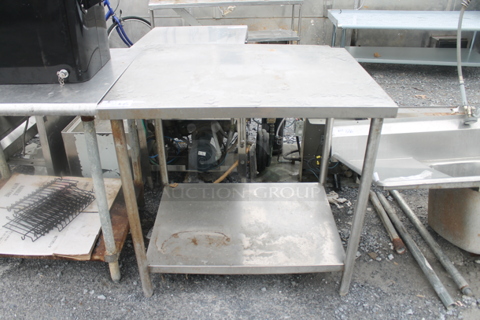 Stainless Steel Commercial Table w/ Metal Under Shelf. 
