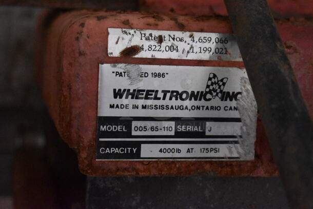 Wheeltronic 005/65-110 Red Metal 4,000 Pound Capacity Car Lift. Was In Working Condition When Class Ended. BUYER MUST REMOVE. (Main Building) - Image 9 of 10