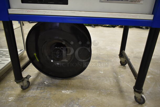Global Metal Commercial Floor Style Automatic Strapping Machine on Commercial Casters. 115 Volts, 1 Phase. Was In Working Condition When Class Ended. (Main Building) - Image 7 of 12