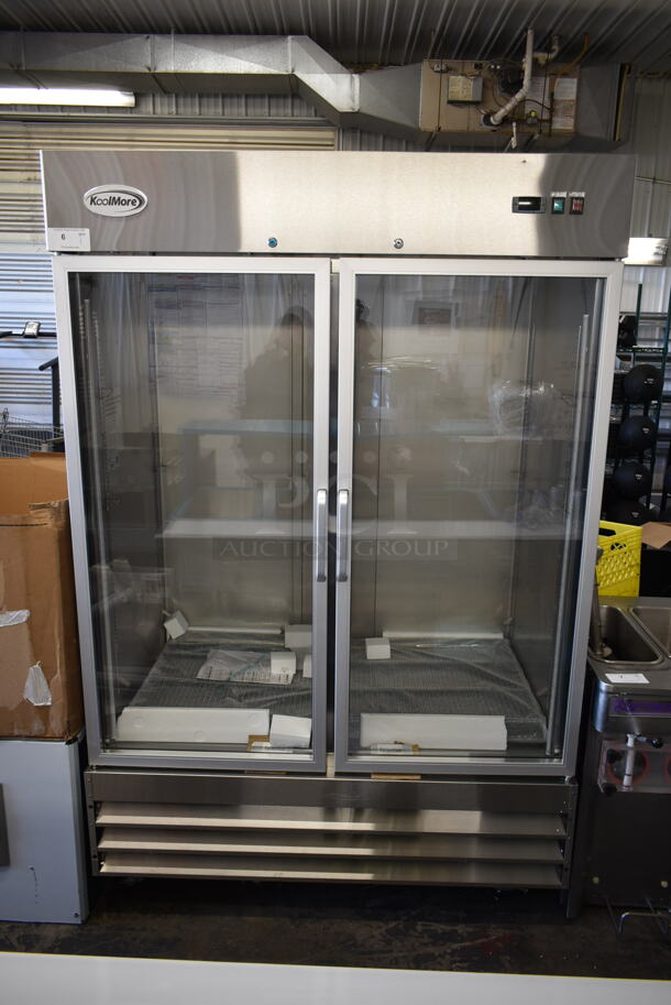 BRAND NEW SCRATCH AND DENT! 2023 KoolMore RIR-2D-GD Stainless Steel Commercial 2 Door Reach In Cooler Merchandiser w/ Poly Coated Racks on Commercial Casters. 115 Volts, 1 Phase. Tested and Working! - Image 1 of 9