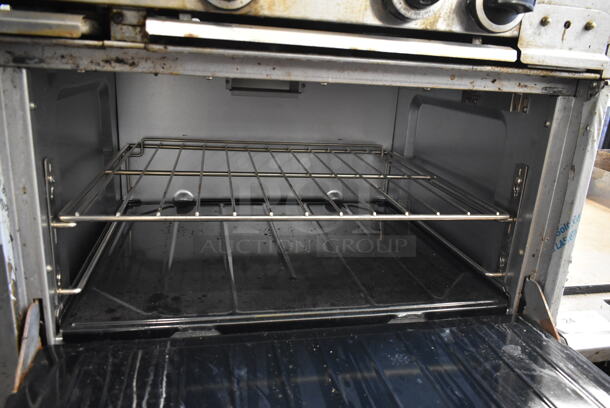 Garland X60-6G24RR Stainless Steel Commercial Natural Gas Powered 6 Burner Range w/ Flat Top Griddle, 2 Ovens, Over Shelf and Back Splash.  - Image 7 of 10