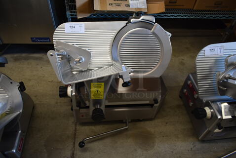 BRAND NEW SCRATCH AND DENT! Estella 348SLAS13 Stainless Steel Commercial Countertop Automatic Meat Slicer w/ Blade Sharpener. 120 Volts, 1 Phase. Tested and Powers On But Parts Do Not Move