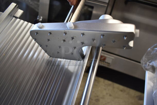 BRAND NEW SCRATCH AND DENT! Estella 348SLAS13 Stainless Steel Commercial Countertop Automatic Meat Slicer w/ Blade Sharpener. 120 Volts, 1 Phase. Tested and Powers On But Parts Do Not Move - Image 6 of 7