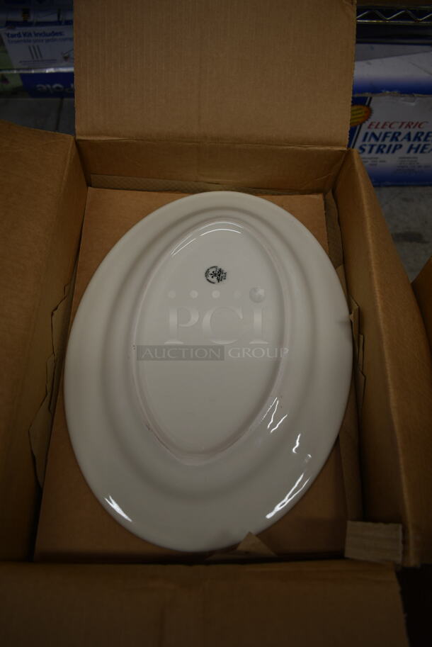 2 Boxes of 12 BRAND NEW! White Ceramic Oval Plates w/ Red Pattern on Rim. 2 Times Your Bid! - Image 5 of 5