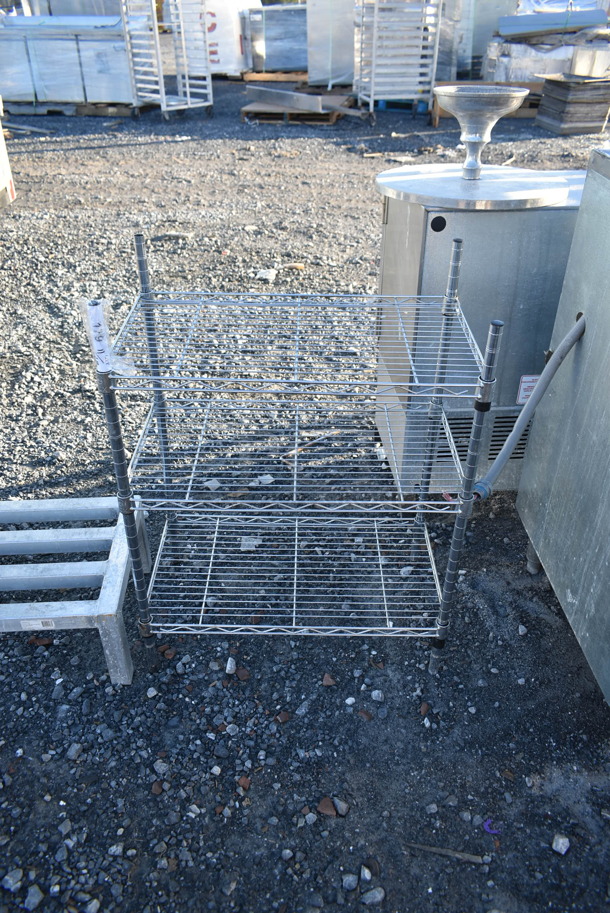 Chrome Finish 3 Tier Shelving Unit. BUYER MUST DISMANTLE. PCI CANNOT DISMANTLE FOR SHIPPING. PLEASE CONSIDER FREIGHT CHARGES. - Image 1 of 2