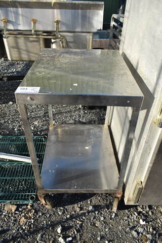 Stainless Steel Commercial Table w/ Under Shelf on Commercial Casters.