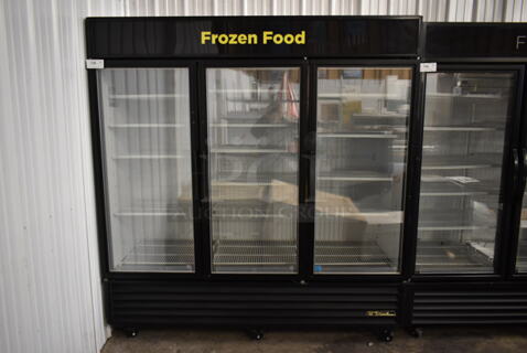 2012 True GDM-72F-LD ENERGY STAR Metal Commercial 3 Door Reach In Freezer Merchandiser w/ Poly Coated Racks on Commercial Casters. 115/208-230 Volts, 1 Phase.