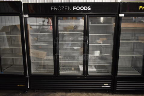 2016 True GDM-72F-HC-TSL01 ENERGY STAR Metal Commercial 3 Door Reach In Freezer Merchandiser w/ Poly Coated Racks on Commercial Casters. 115/208-230 Volts, 1 Phase.