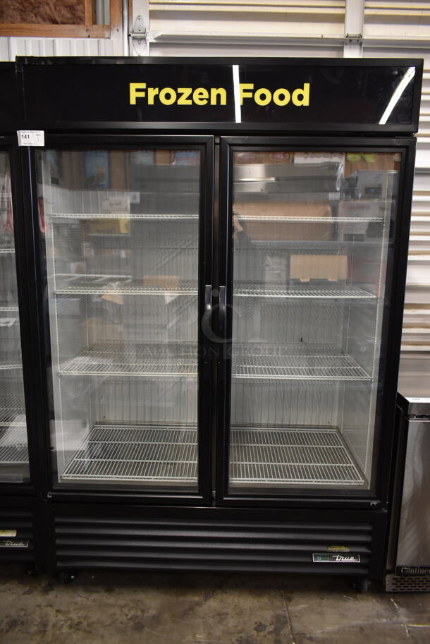 2017 True  GDM-49F-HC-TSL01 ENERGY STAR Metal Commercial 2 Door Reach In Freezer Merchandiser w/ Poly Coated Racks on Commercial Casters. 115/208-230 Volts, 1 Phase.
 - Image 1 of 8