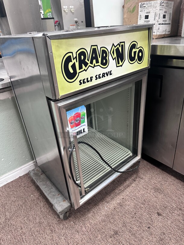 True GDM-05PT 24 inch Countertop Refrigerator w/ Pass Thru Access - Swing Door, Black, 115v Working - Image 1 of 8