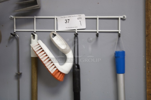 Wall Mounted Wire With Hooks For Hanging Mop/Broom/Cleaning and Etc. Everything Pictured Is Included.  - Image 1 of 2