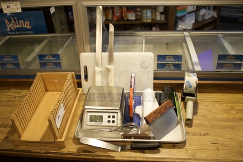 ALL-FOR-ONE: Bread Slicer Cutting Guide. Cutting Board, Sheet Pan, Knives, Grill Tools, Baking Tools, Labeler, Garbage Bags, Digital Scale, Wooden Recipe Holder, Tape Gun, Spatula, Whisk