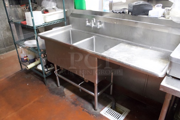 Advance Tabco FC-2-2424-18 Two Compartment Stainless Steel Commercial Sink with One Right Side Drainboard - 68 1/2" Includes Twist Handle Waste Valve Setups.  - Image 1 of 4