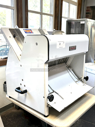 LIKE NEW! Estella Countertop Bread Slicer - 3/4" Slice Thickness, 18 3/4" Max Loaf Length - 110V. Stainless Steel Construction, Yield 240 Slicers Per Hour, Fits bread loaf sizes up to 6" x 18 3/4" Includes Manual. 26.6" X 24.8 " X 29.1"