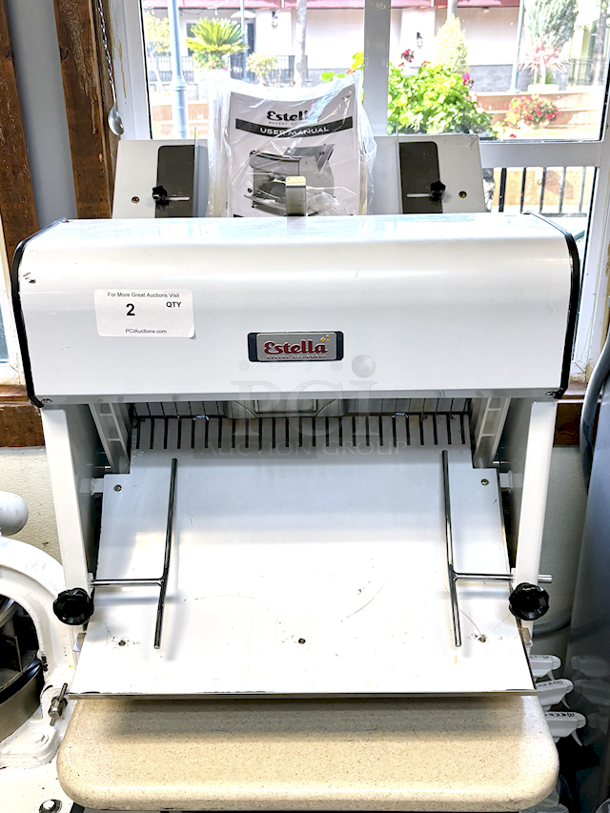 LIKE NEW! Estella Countertop Bread Slicer - 3/4" Slice Thickness, 18 3/4" Max Loaf Length - 110V. Stainless Steel Construction, Yield 240 Slicers Per Hour, Fits bread loaf sizes up to 6" x 18 3/4" Includes Manual. 26.6" X 24.8 " X 29.1" - Image 3 of 6