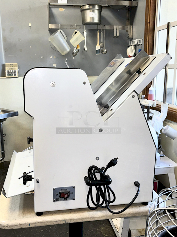LIKE NEW! Estella Countertop Bread Slicer - 3/4" Slice Thickness, 18 3/4" Max Loaf Length - 110V. Stainless Steel Construction, Yield 240 Slicers Per Hour, Fits bread loaf sizes up to 6" x 18 3/4" Includes Manual. 26.6" X 24.8 " X 29.1" - Image 5 of 6
