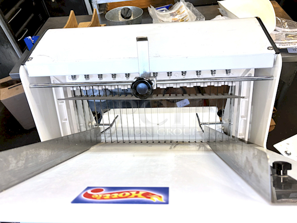 LIKE NEW! Estella Countertop Bread Slicer - 3/4" Slice Thickness, 18 3/4" Max Loaf Length - 110V. Stainless Steel Construction, Yield 240 Slicers Per Hour, Fits bread loaf sizes up to 6" x 18 3/4" Includes Manual. 26.6" X 24.8 " X 29.1" - Image 6 of 6