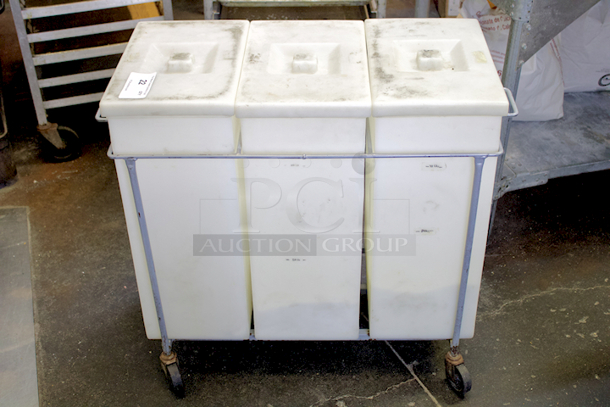 Faribo P434 3-Compartment White Ingredient Bin Assembly With Covers On Steel Framed Cart With Casters. CAPACITIES: Each bin can hold 75 Lbs. of Sugar, 55 Lbs. of Flour or 12 Gallons of Liquids. Individual Bin Dimensions: 14-5/8" x 9-1/4" x 23" 
Overall Dimensions: 33-1/2" x 16-1/2" x 28-1/4" - Image 2 of 6