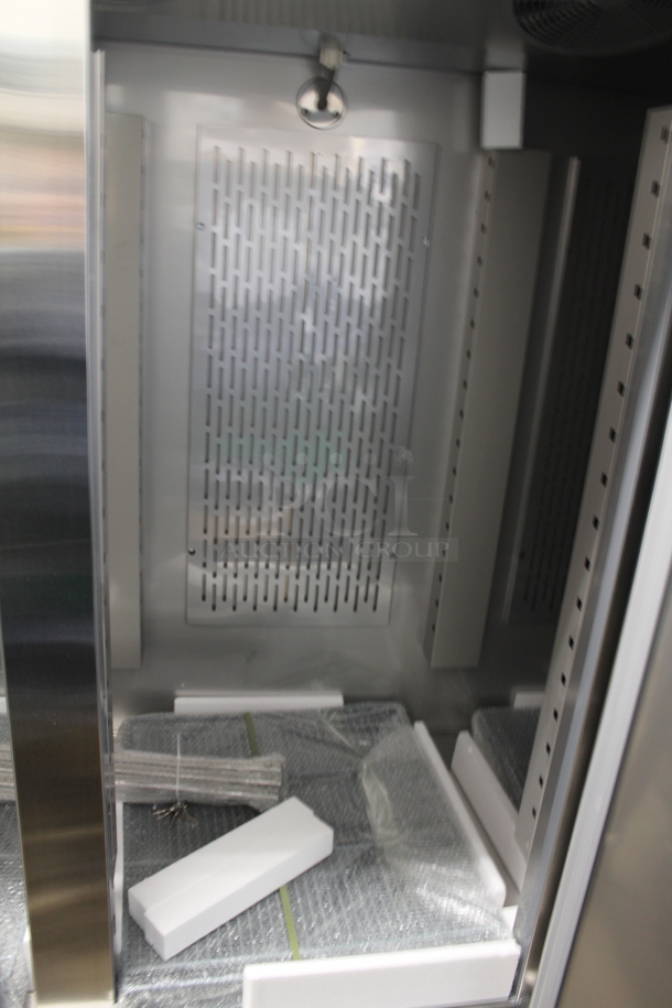 BRAND NEW SCRATCH AND DENT! 2023 Avantco 178SS3FHC Stainless Steel Commercial 3 Door Reach In Freezer w/ Poly Coated Racks on Commercial Casters. 115 Volts, 1 Phase.  Tested and Working! - Image 5 of 7