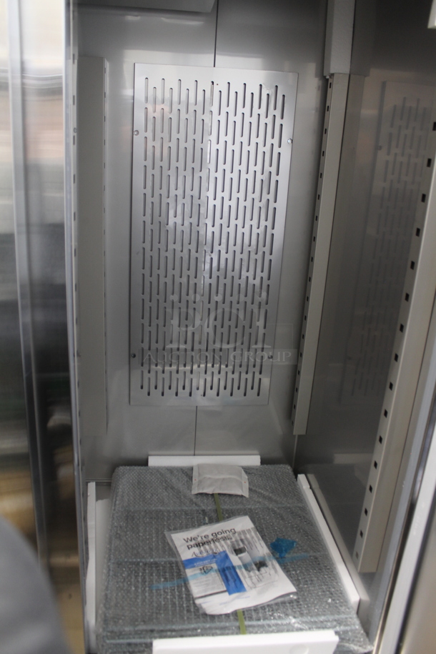 BRAND NEW SCRATCH AND DENT! 2023 Avantco 178SS3FHC Stainless Steel Commercial 3 Door Reach In Freezer w/ Poly Coated Racks on Commercial Casters. 115 Volts, 1 Phase.  Tested and Working! - Image 6 of 7