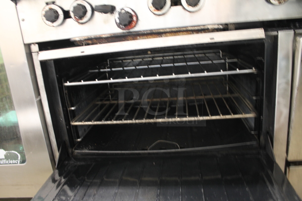 Garland Stainless Steel Commercial Natural Gas Powered 10 Burner Range w/ 2 Ovens, Over Shelf and Back Splash.  - Image 5 of 5