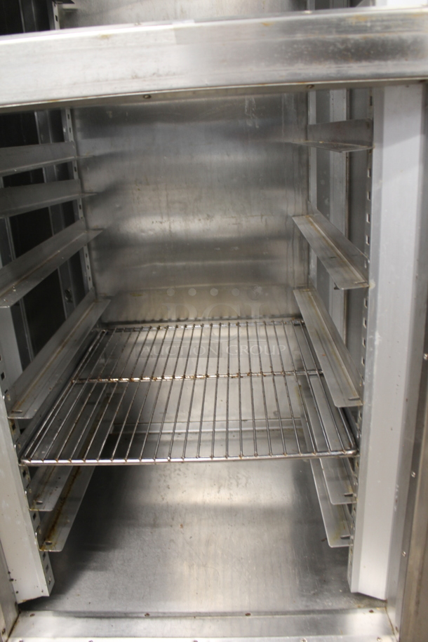 Traulsen Stainless Steel Commercial 4 Half Size Door Reach In Cooler w/ Metal Racks. Tested and Powers On But Does Not Get Cold - Image 4 of 6