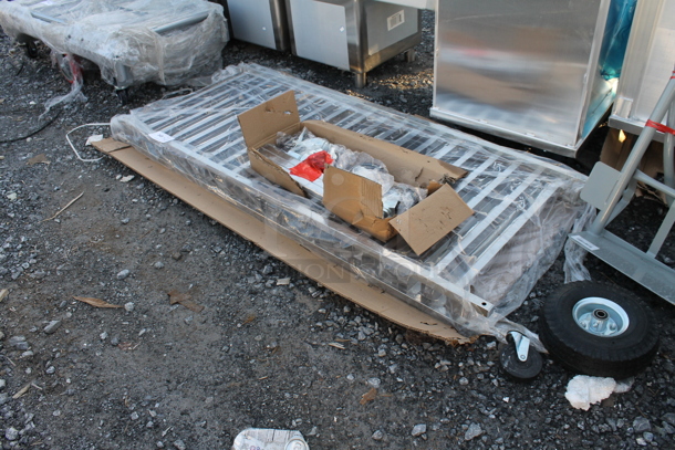 BRAND NEW SCRATCH AND DENT! Regency 600PR20316K Metal Pan Rack w/ Commercial Casters. Unassembled - Image 2 of 3