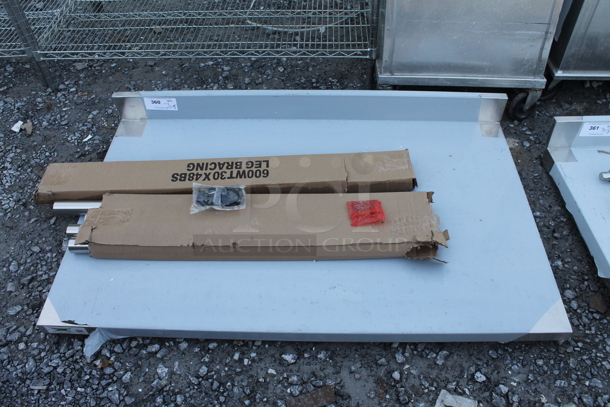 BRAND NEW SCRATCH AND DENT! Regency 600WT30X48BS 30" x 48" 16-Gauge 304 Stainless Steel Commercial Open Base Work Table with 4" Backsplash - Image 2 of 5
