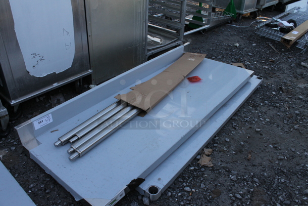 BRAND NEW SCRATCH AND DENT! Regency 600TSB2460S 24" x 60" 16-Gauge Stainless Steel Commercial Work Table with 4" Backsplash and Undershelf - Image 3 of 4