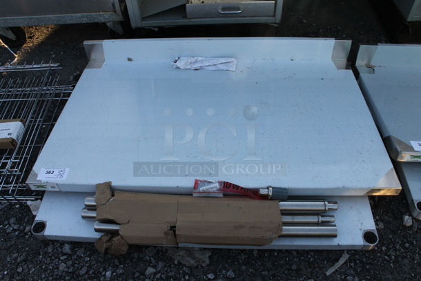 BRAND NEW SCRATCH AND DENT! Regency 600TSB3048S 30" x 48" 16-Gauge Stainless Steel Commercial Work Table with 4" Backsplash and Undershelf - Image 2 of 4