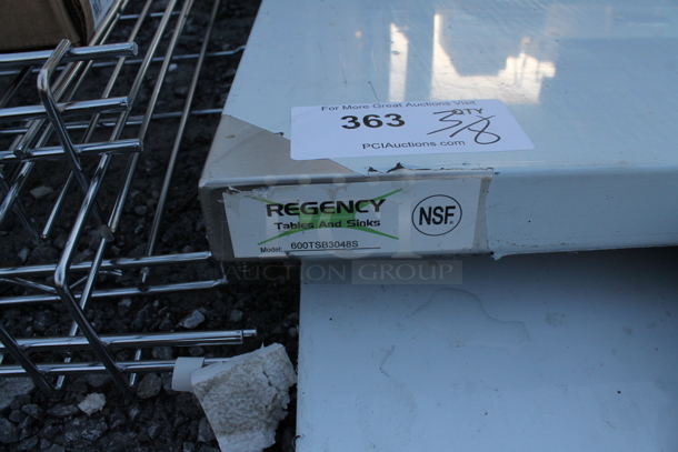 BRAND NEW SCRATCH AND DENT! Regency 600TSB3048S 30" x 48" 16-Gauge Stainless Steel Commercial Work Table with 4" Backsplash and Undershelf - Image 4 of 4