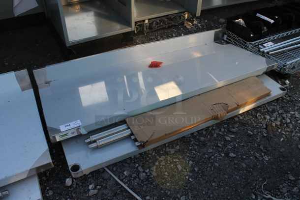 BRAND NEW SCRATCH AND DENT! Regency 600TSB2460S 24" x 60" 16-Gauge Stainless Steel Commercial Work Table with 4" Backsplash and Undershelf - Image 2 of 5