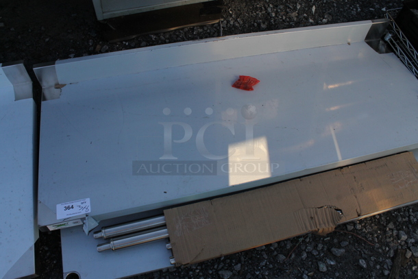 BRAND NEW SCRATCH AND DENT! Regency 600TSB2460S 24" x 60" 16-Gauge Stainless Steel Commercial Work Table with 4" Backsplash and Undershelf - Image 3 of 5