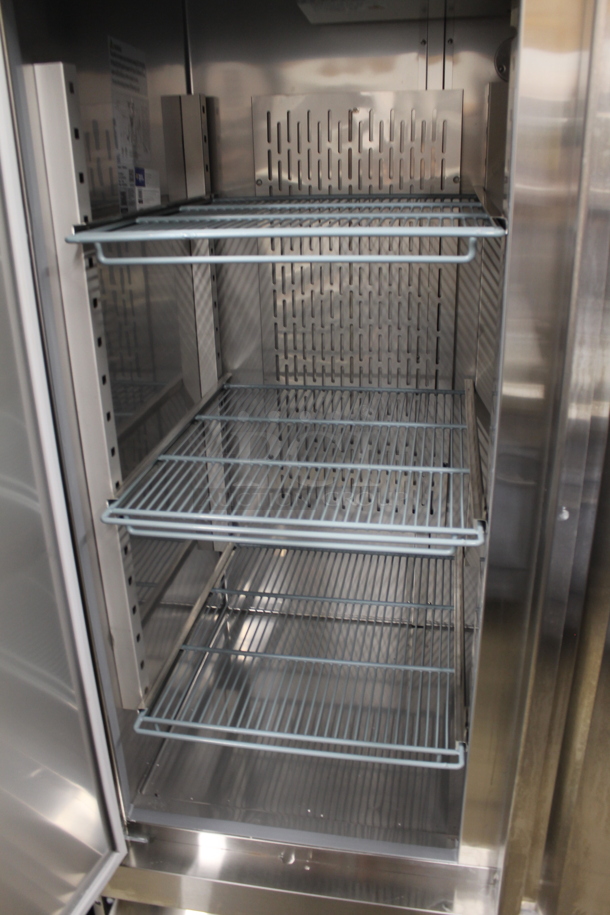 BRAND NEW SCRATCH AND DENT! 2023 Avantco 178SS2RHC Stainless Steel Commercial 2 Door Reach In Cooler w/ Poly Coated Racks on Commercial Casters. 115 Volts, 1 Phase.  Tested and Working! - Image 6 of 8