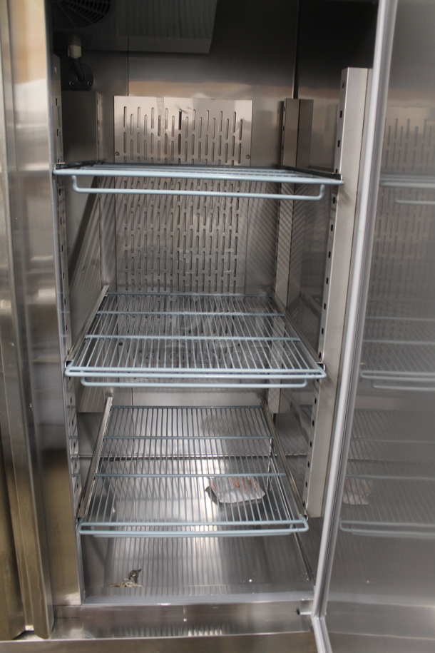 BRAND NEW SCRATCH AND DENT! 2023 Avantco 178SS2RHC Stainless Steel Commercial 2 Door Reach In Cooler w/ Poly Coated Racks on Commercial Casters. 115 Volts, 1 Phase.  Tested and Working! - Image 8 of 8