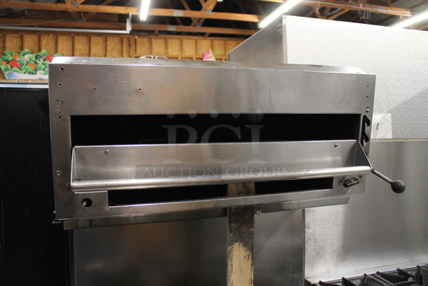 Stainless Steel Commercial Natural Gas Powered 6 Burner Range w/ Salamander Cheese Melter and Oven.  - Image 2 of 6