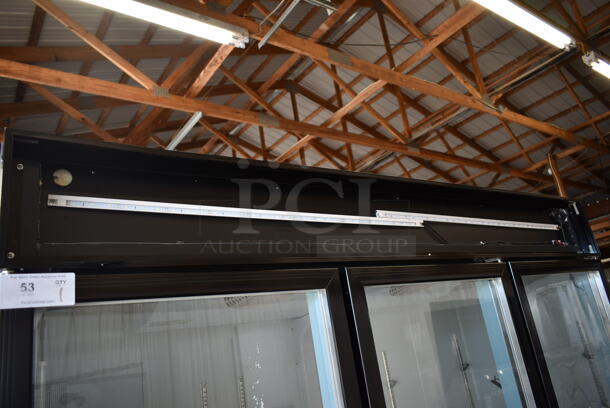 BRAND NEW SCRATCH AND DENT! 2023 Avantco 178GDC69HCB Metal Black 3 Door Reach In Cooler Swing Glass Door Merchandiser Refrigerator with LED Lighting and Poly Coated Racks. 115 Volts, 1 Phase.  Tested and Working! - Image 4 of 9