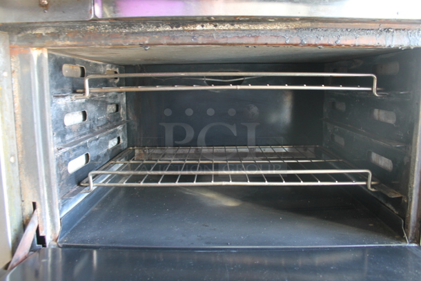Dynamic Cooking Systems DCS Stainless Steel Commercial Natural Gas Powered 6 Burner Range w/ Right Side Flat Top Griddle and 2 Ovens on Commercial Casters. - Image 6 of 7